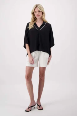 V hals geweven top met zigzag detail